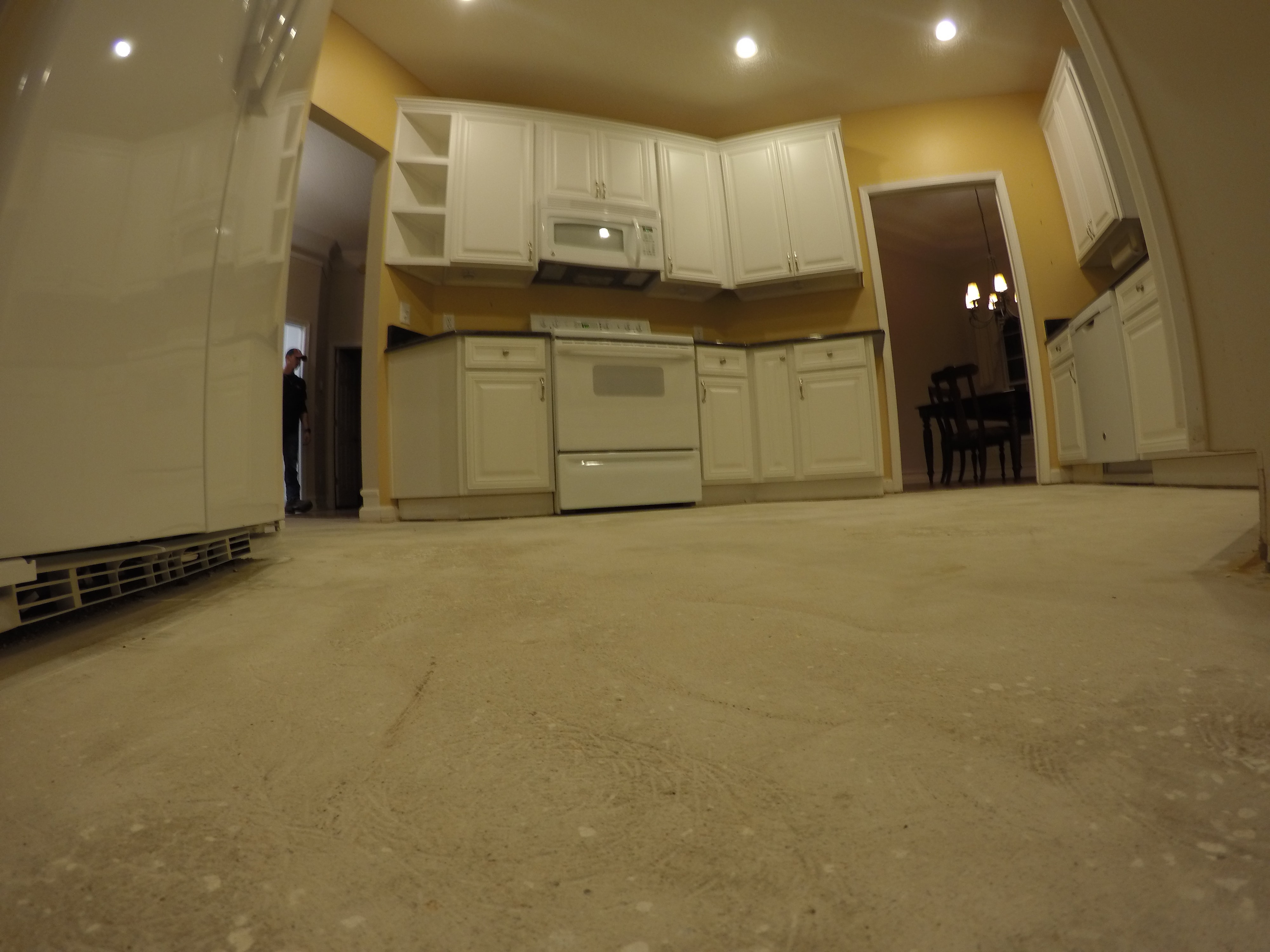 Image of a clean kitchen sub-floor after tile floor removal