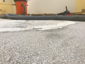 cement floor that has been ground down and is clean of all dust and debris